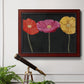 Contemporary poppy flower artwork in an ornate cherry burl wood frame displayed in a light-toned interior setting.