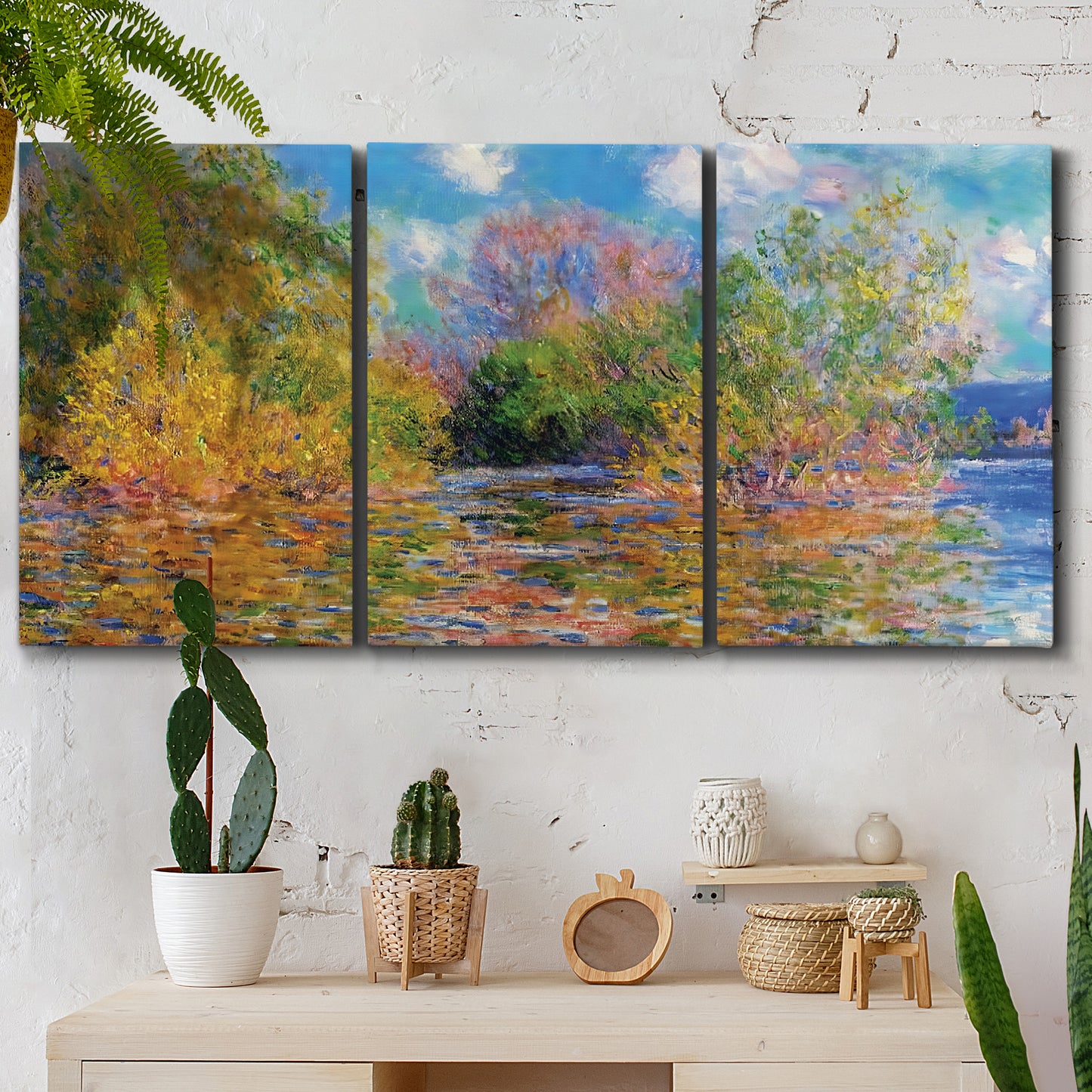 Three-panel canvas wall art featuring wide river landscape, displayed in a boho-chic entryway above a console table.