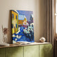 Canvas art print of a stylized village scene with simplified forms and vivid tones styled in a home decor setting.