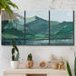 Three-panel canvas wall art featuring muted mountain range in grey tones, displayed in a boho-chic entryway above a console table.