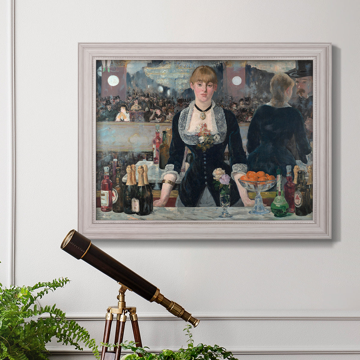 Iconic impressionist café bar scene by Édouard Manet in an ornate weathered white frame displayed in a light-toned interior setting.