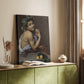Canvas art print of a figure holding fruit with strong contrast and shadow styled in a home decor setting.