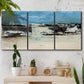 Three-panel canvas wall art featuring abstract bridge landscape in cyan, displayed in a boho-chic entryway above a console table.