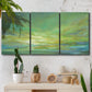 Three-panel canvas wall art featuring coastal shoreline under open sky, displayed in a boho-chic entryway above a console table.