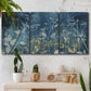 Three-panel canvas wall art featuring dark abstract with rich tonal depth, displayed in a boho-chic entryway above a console table.