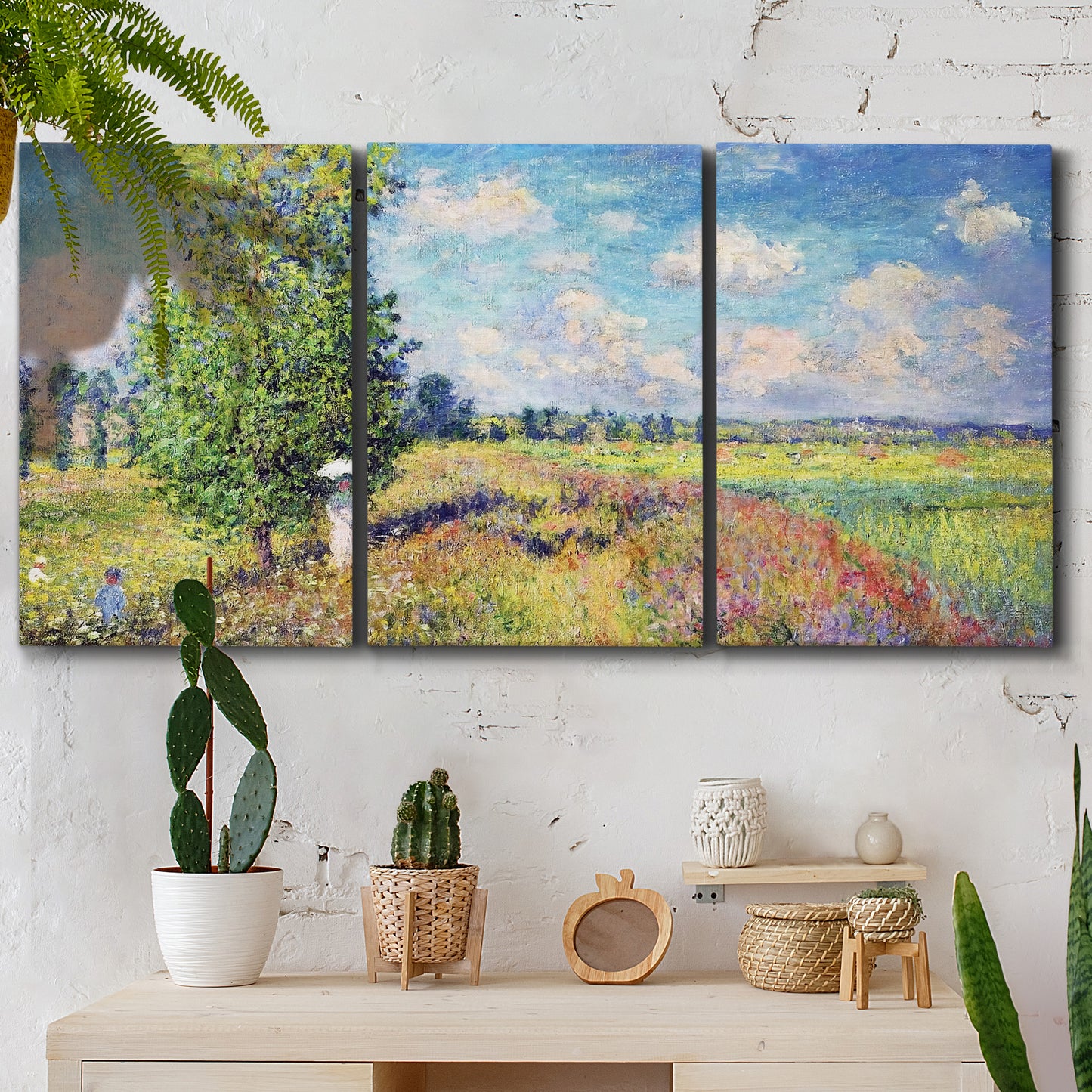 Three-panel canvas wall art featuring sunlit meadow landscape, displayed in a boho-chic entryway above a console table.