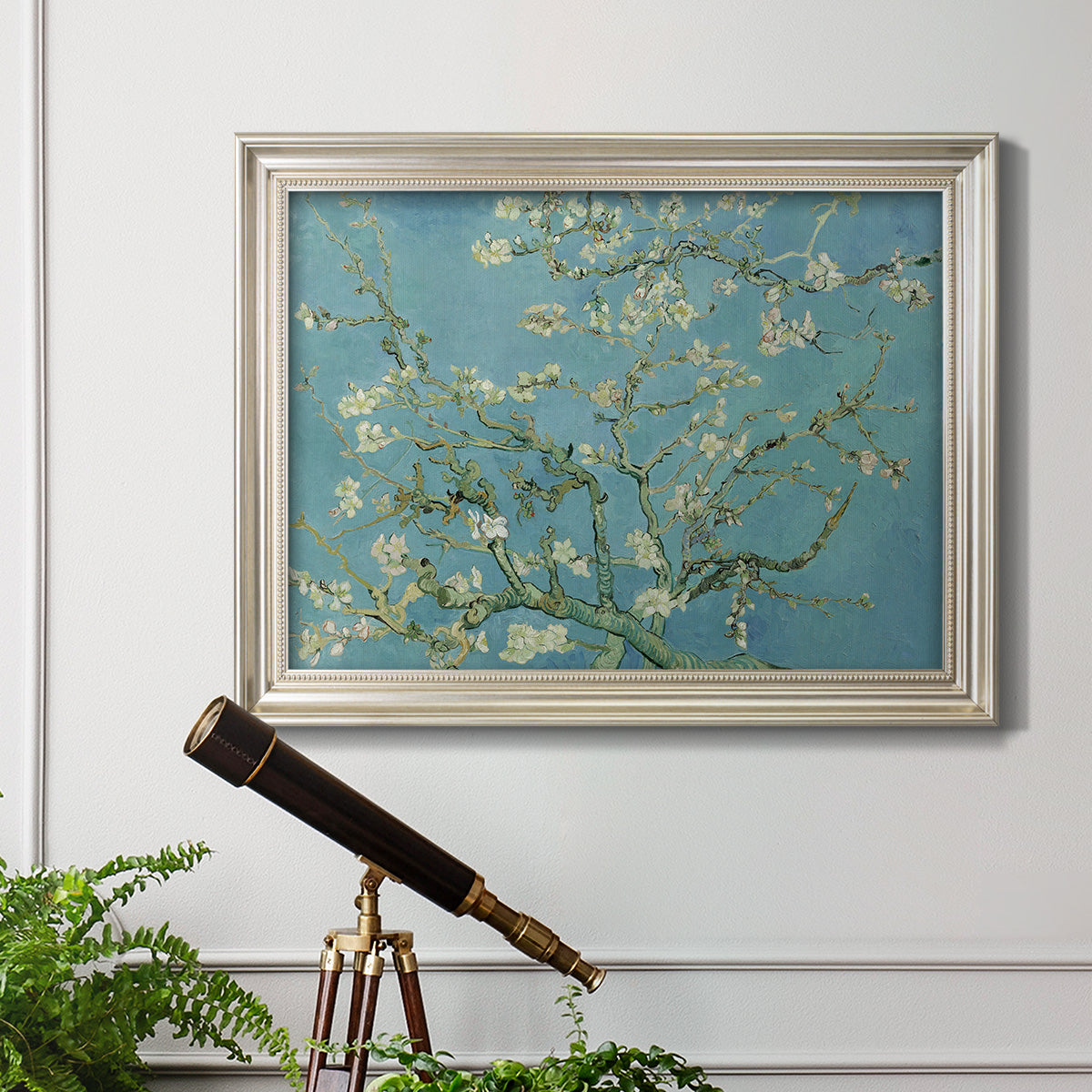 Impressionist flowering almond branch painting by Vincent van Gogh in an ornate champagne frame displayed in a light-toned interior setting.