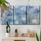 Three-panel canvas wall art featuring delicate watercolor floral blooms, displayed in a boho-chic entryway above a console table.