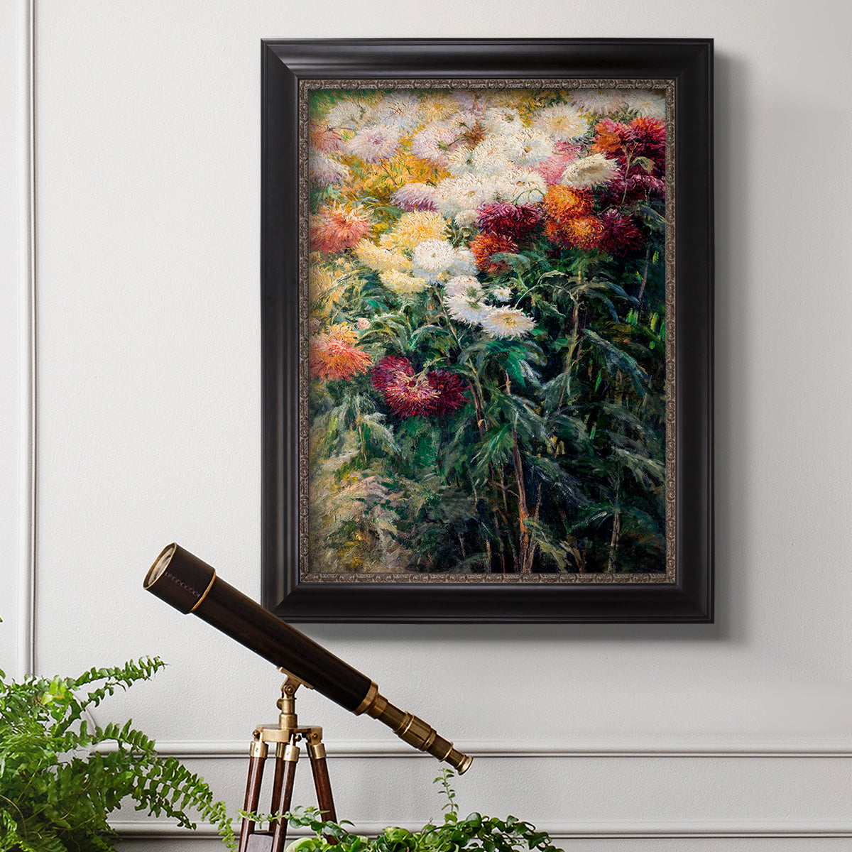 Impressionist garden floral painting by Gustave Caillebotte in an ornate black frame with gilded inner detail displayed in a light-toned interior setting.