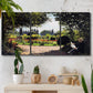 Three-panel canvas wall art featuring coastal garden overlooking sea, displayed in a boho-chic entryway above a console table.