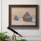 Impressionist winter haystack scene by Claude Monet in an ornate bronzed mahogany wood frame displayed in a light-toned interior setting.