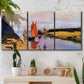 Three-panel canvas wall art featuring stone breakwater at low tide, displayed in a boho-chic entryway above a console table.