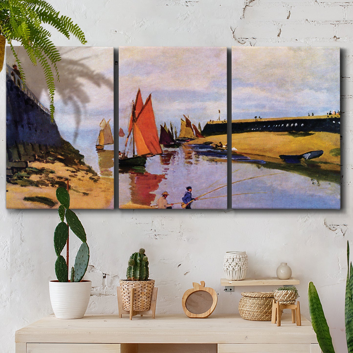 Three-panel canvas wall art featuring stone breakwater at low tide, displayed in a boho-chic entryway above a console table.