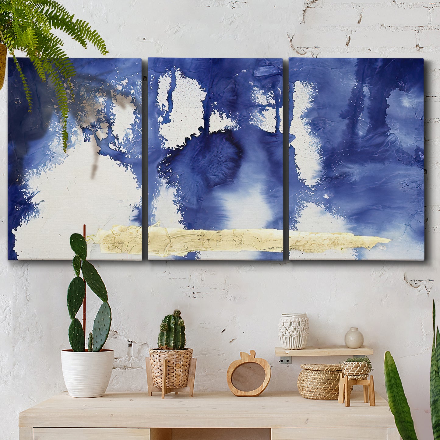 Three-panel canvas wall art featuring saturated abstract color fields, displayed in a boho-chic entryway above a console table.