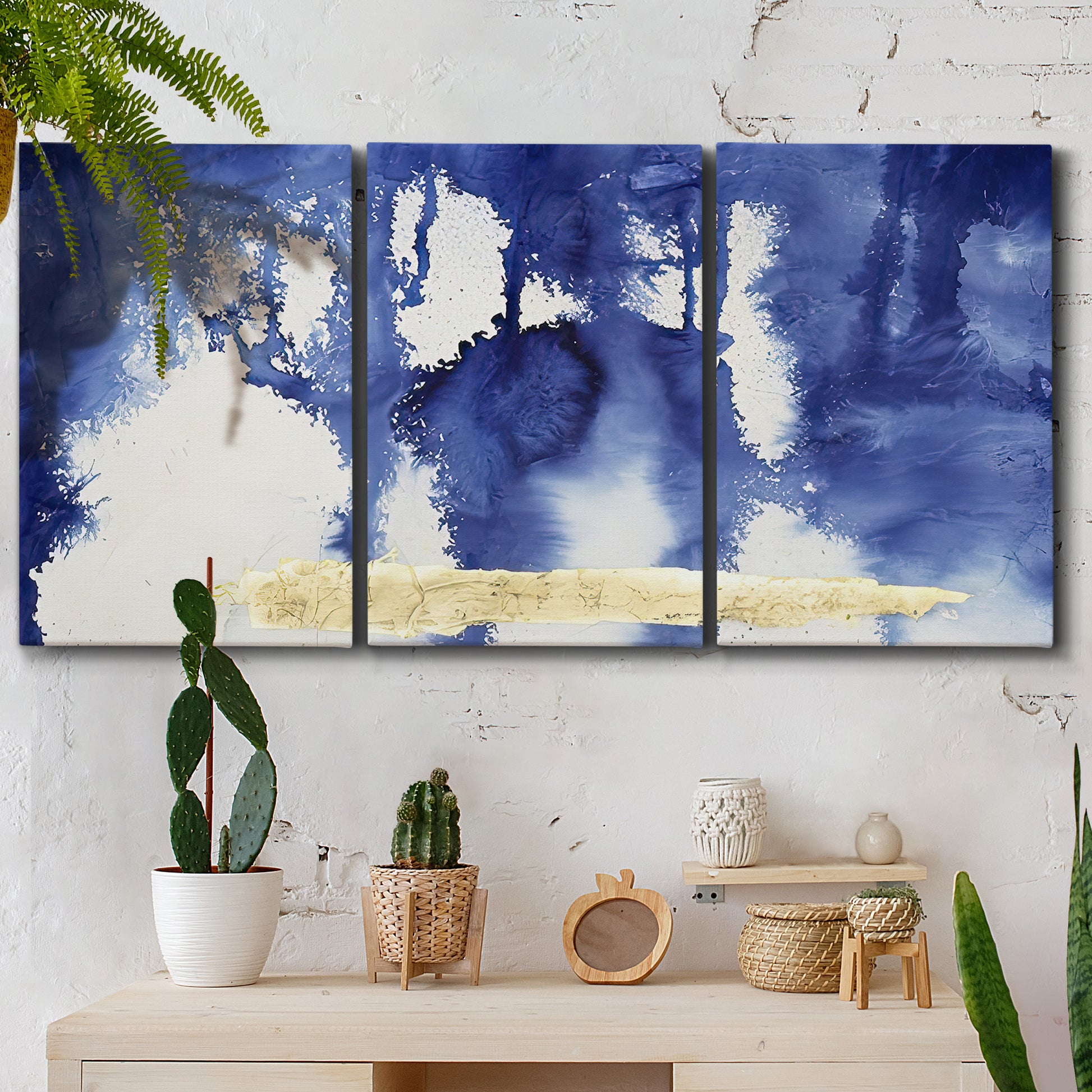 Three-panel canvas wall art featuring saturated abstract color fields, displayed in a boho-chic entryway above a console table.