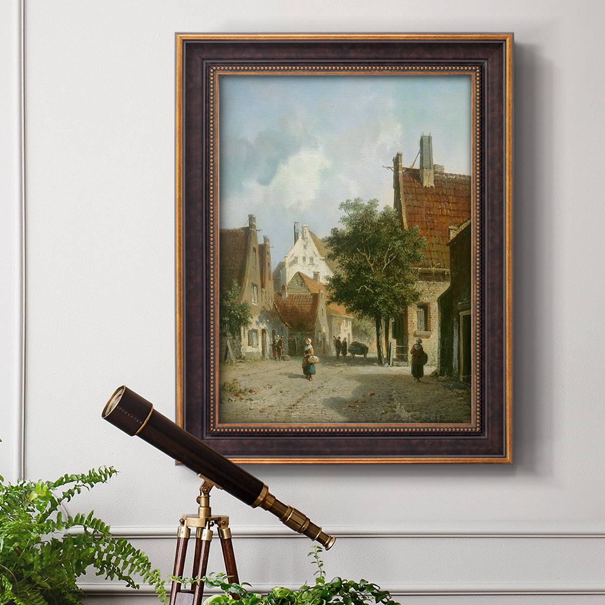 Rustic European street scene painting by Adriaan Eversen in an ornate bronzed mahogany wood frame displayed in a light-toned interior setting.