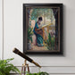 Impressionist portrait of Madame Monet sewing by Claude Monet in an ornate black frame with gilded inner detail displayed in a light-toned interior setting.