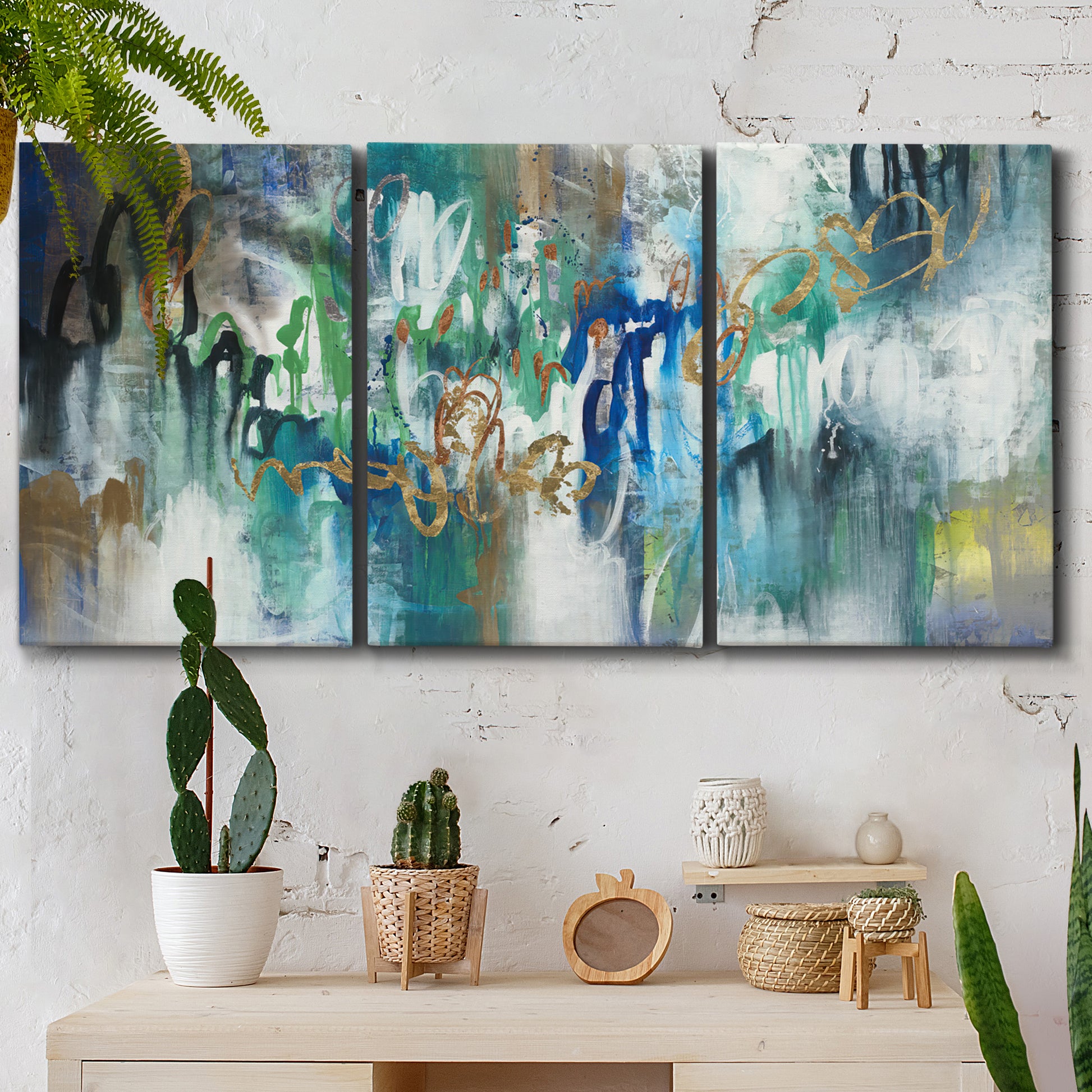 Three-panel canvas wall art featuring joyful abstract color harmony, displayed in a boho-chic entryway above a console table.