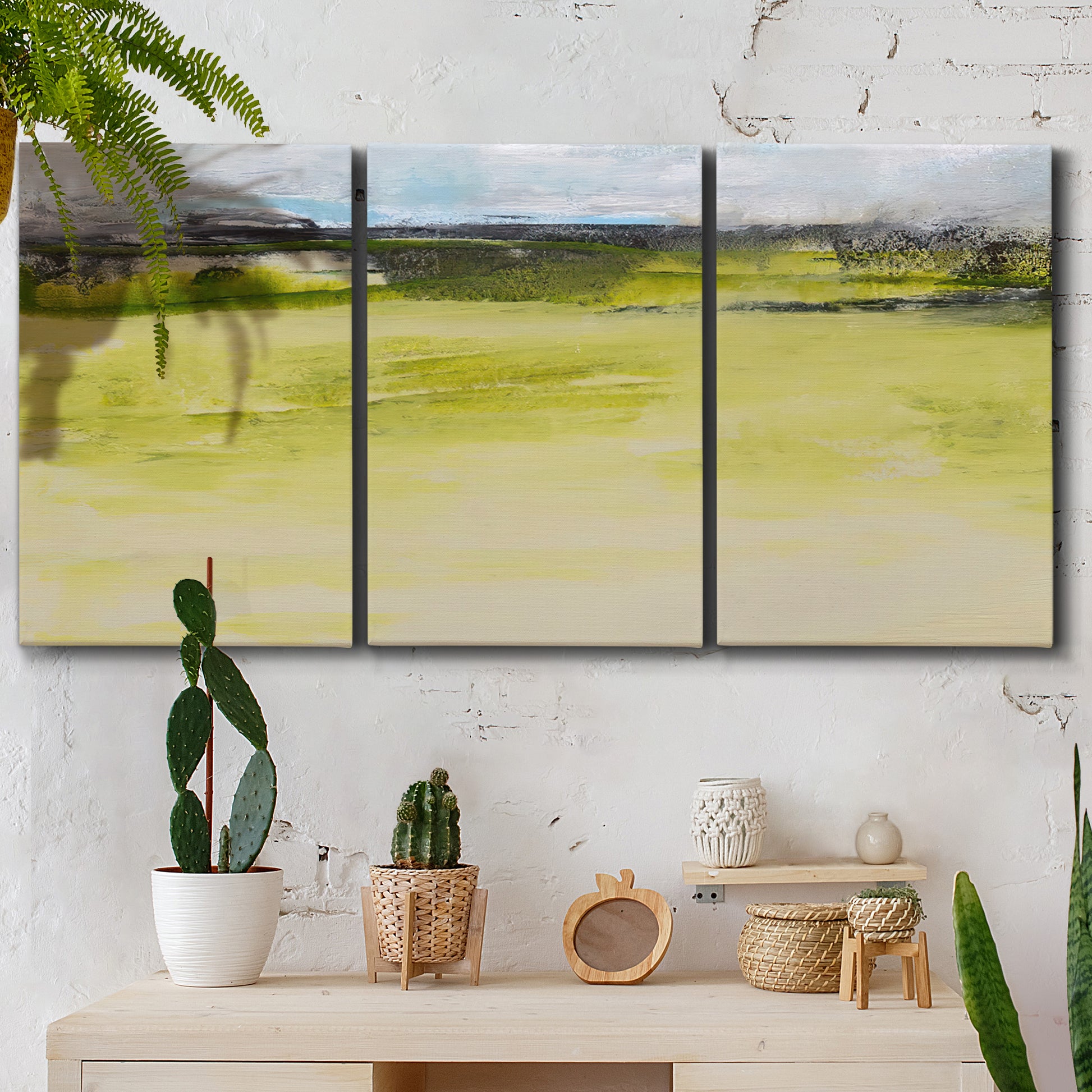 Three-panel canvas wall art featuring abstract terrace landscape view, displayed in a boho-chic entryway above a console table.
