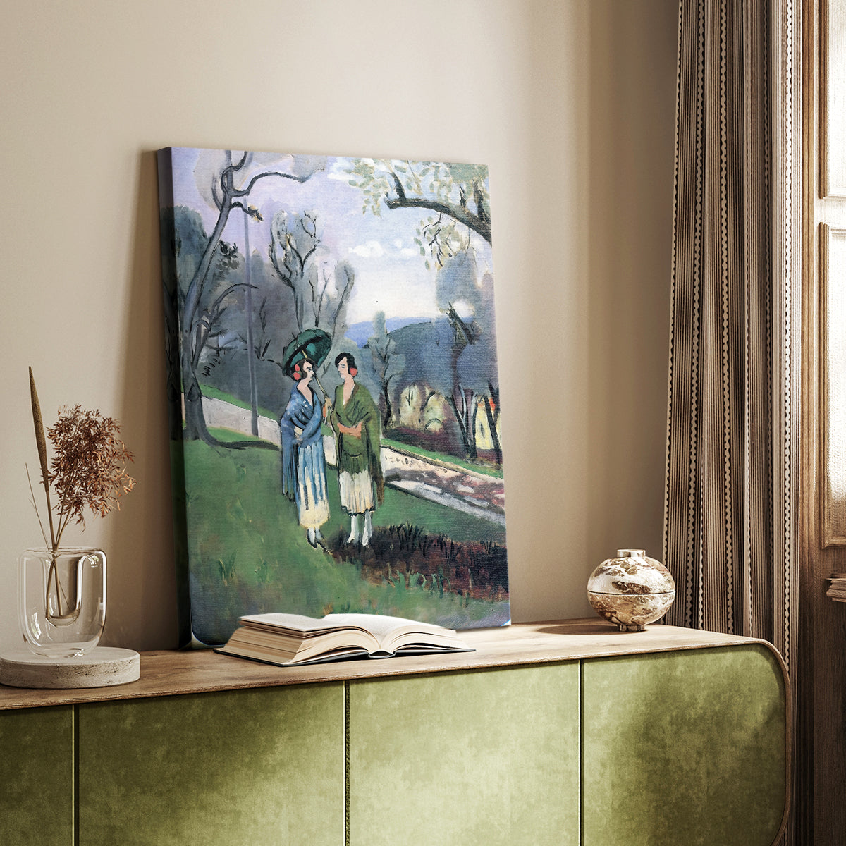 Canvas art print of a stylized landscape with people and bold green tones styled in a home decor setting.