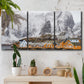 Three-panel canvas wall art featuring winter village street photography, displayed in a boho-chic entryway above a console table.