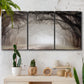 Three-panel canvas wall art featuring tree lined plantation road, displayed in a boho-chic entryway above a console table.