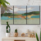 Three-panel canvas wall art featuring wide open landscape under midday light, displayed in a boho-chic entryway above a console table.