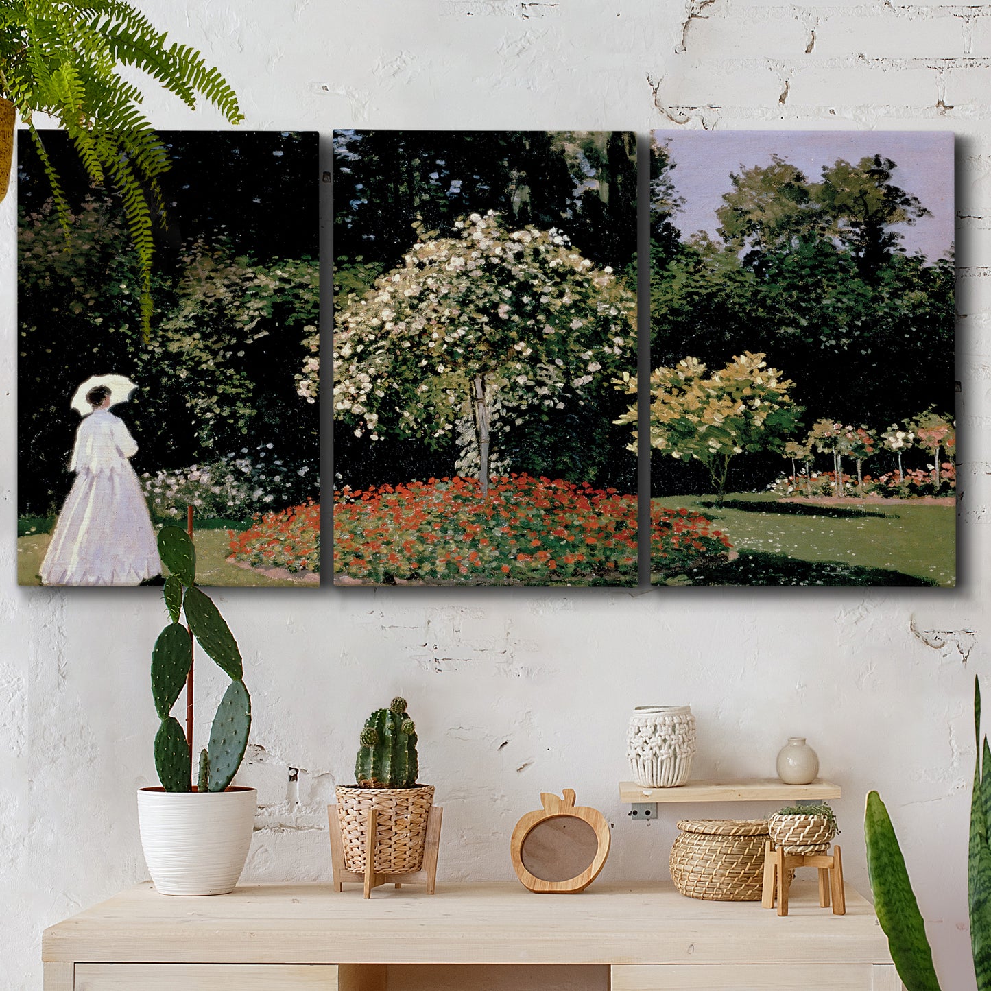 Three-panel canvas wall art featuring woman seated in garden landscape, displayed in a boho-chic entryway above a console table.