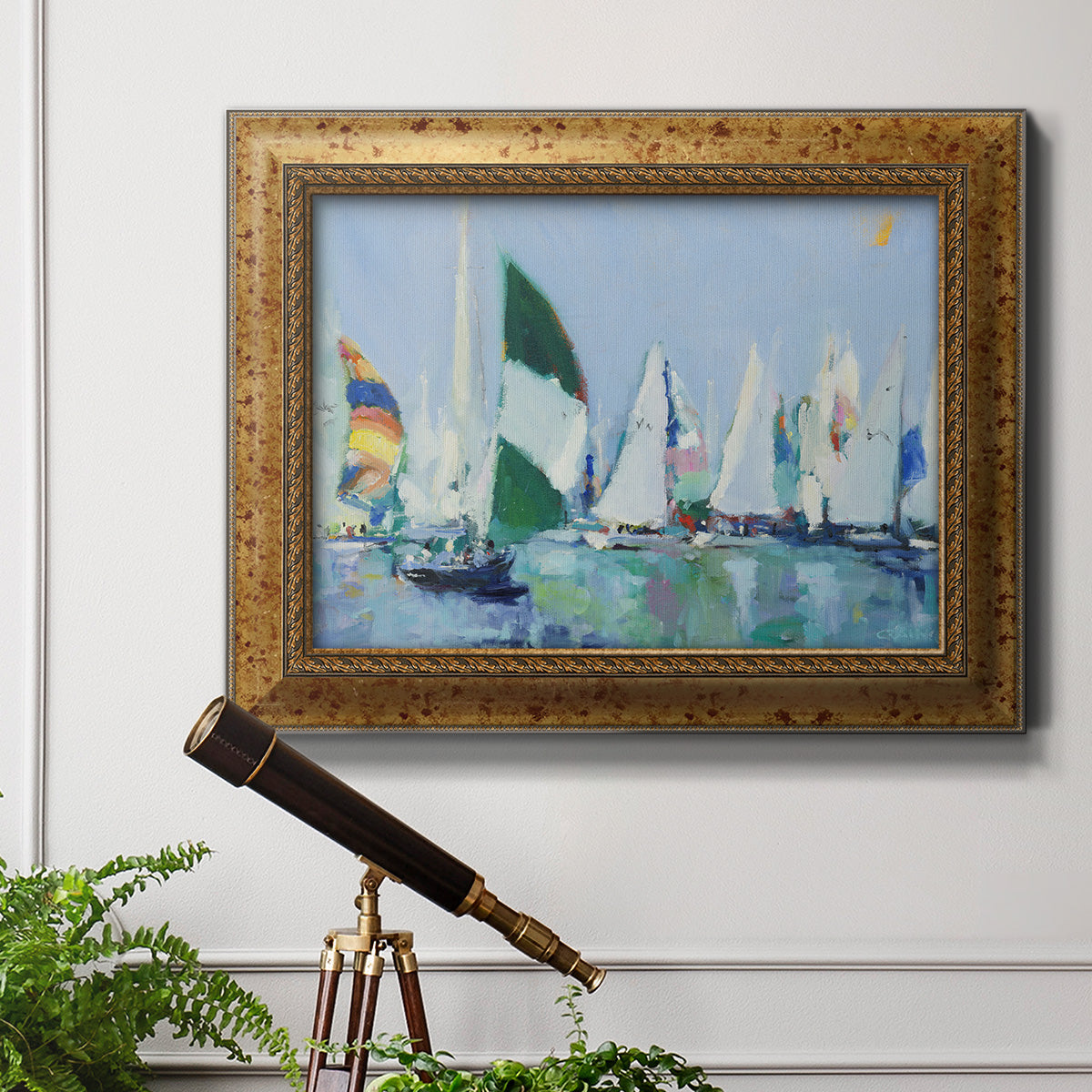 Coastal harbor watercolor painting in an ornate vintage gold frame displayed in a light-toned interior setting.