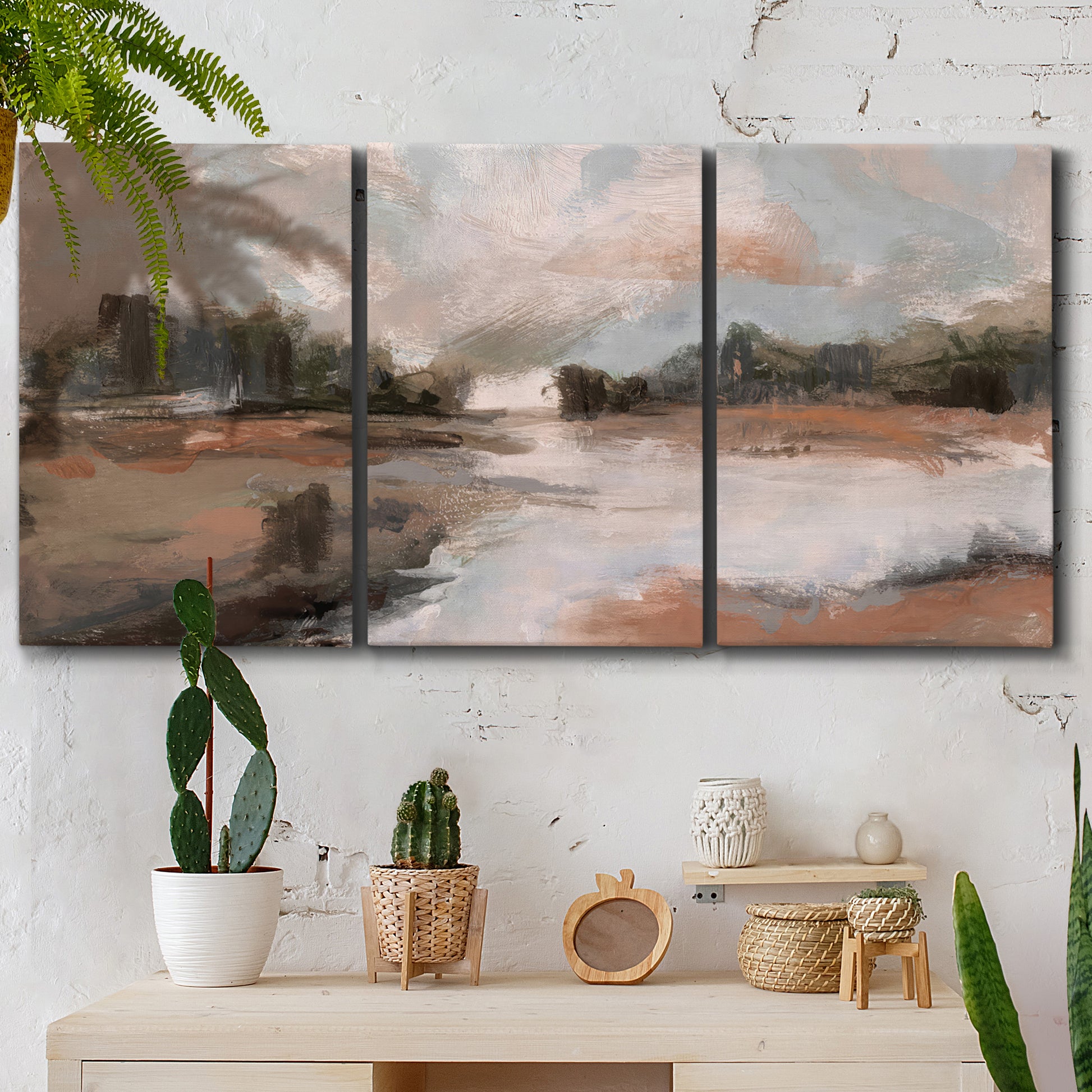 Three-panel canvas wall art featuring quiet pond with soft reflections, displayed in a boho-chic entryway above a console table.