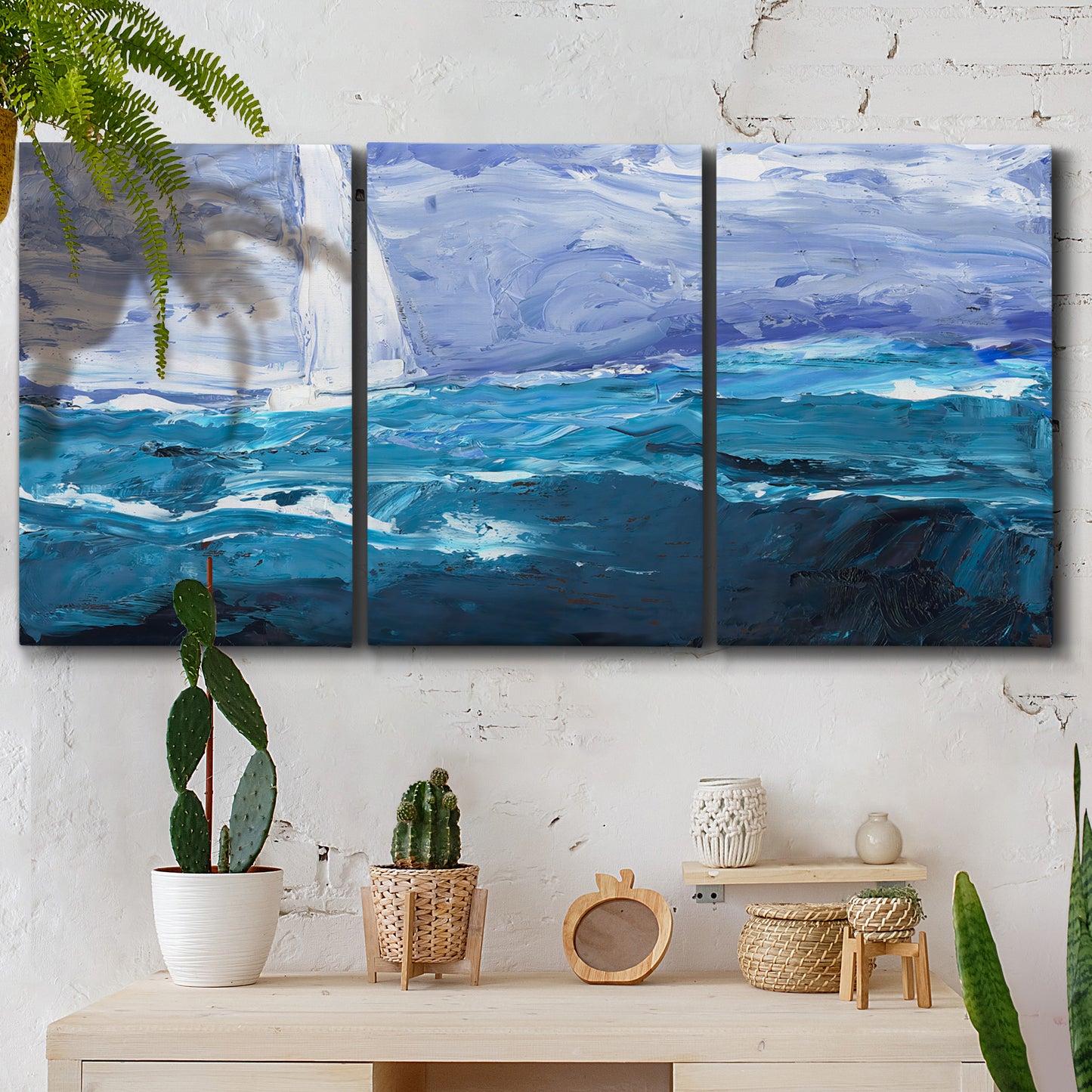 Three-panel canvas wall art featuring impressionist nautical harbor scene, displayed in a boho-chic entryway above a console table.