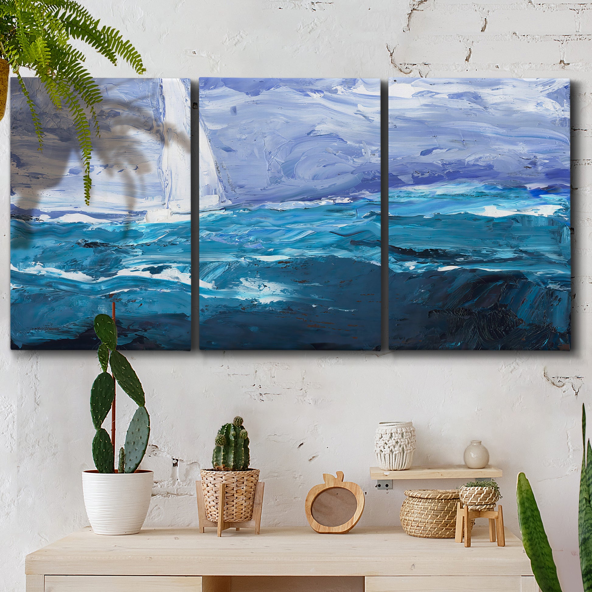 Three-panel canvas wall art featuring impressionist nautical harbor scene, displayed in a boho-chic entryway above a console table.