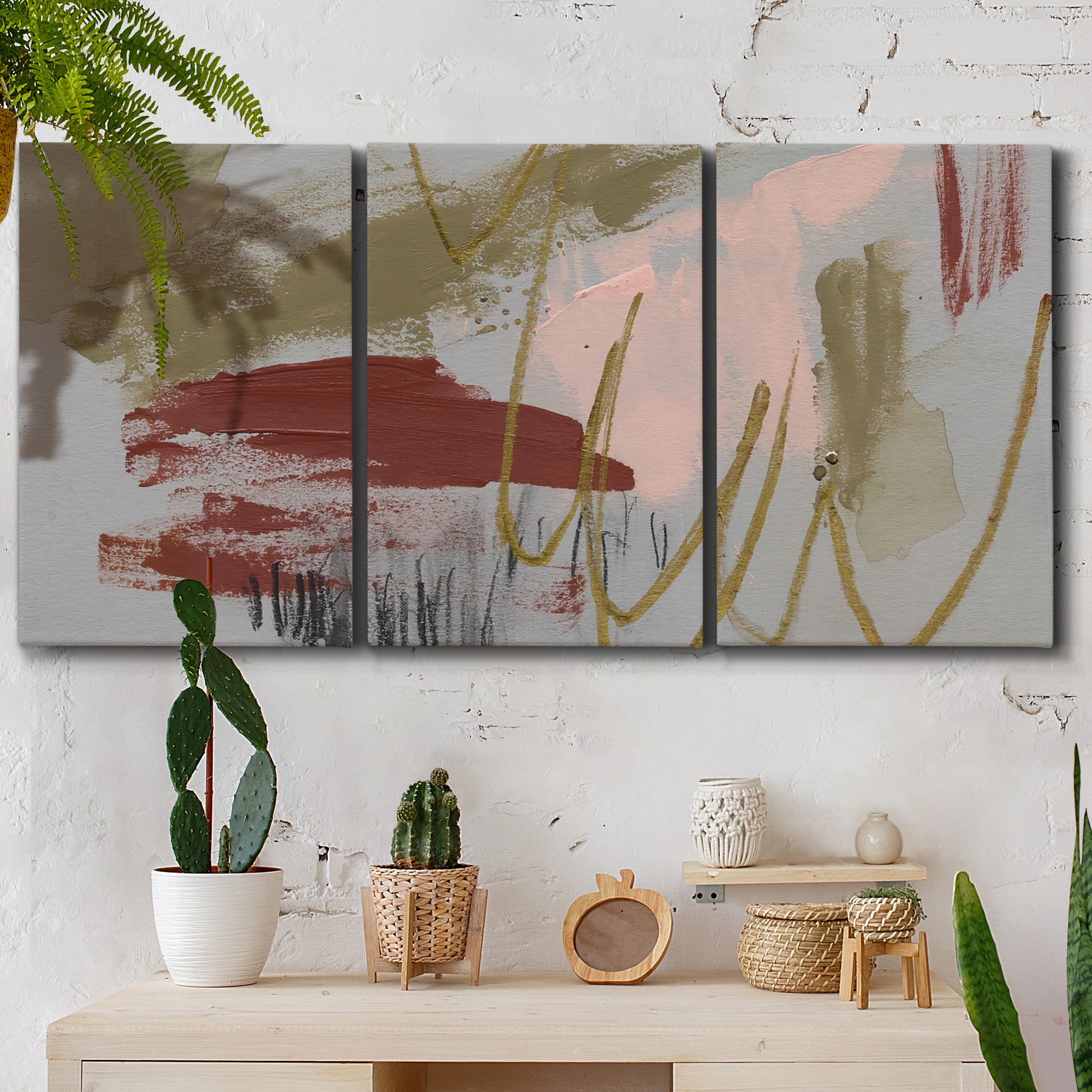 Three-panel canvas wall art featuring minimalist abstract line textures, displayed in a boho-chic entryway above a console table.