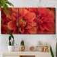 Three-panel canvas wall art featuring vivid red floral close up, displayed in a boho-chic entryway above a console table.
