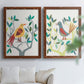Set of two maple barnwood framed canvas prints depicting red yellow blue plumage, simplified leaves, and playful flat shapes arranged across two complementary compositions above a sofa in a bright living space.