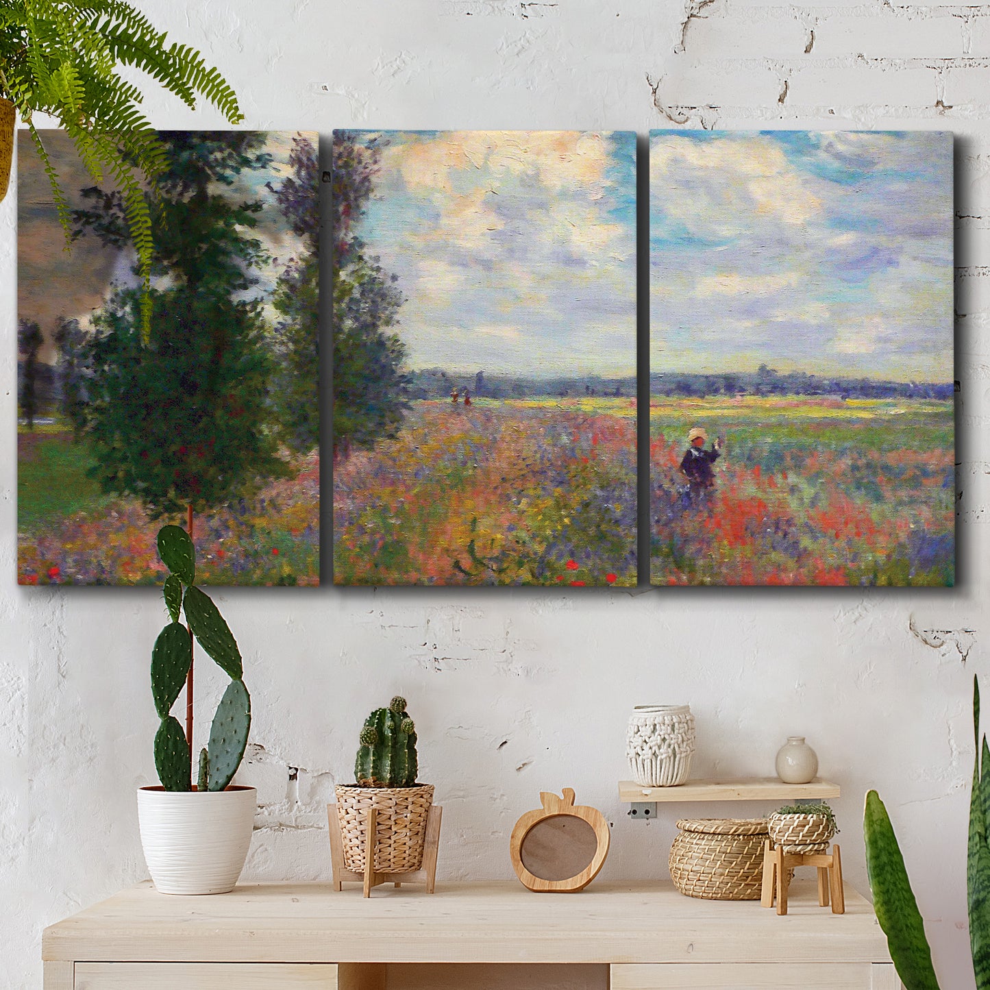 Three-panel canvas wall art featuring poppy field in open countryside, displayed in a boho-chic entryway above a console table.