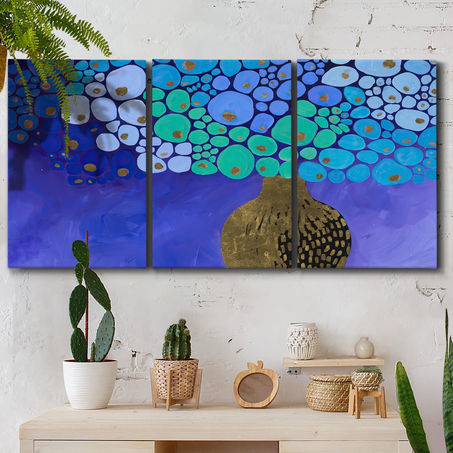 Three-panel canvas wall art featuring blue poppy floral abstraction, displayed in a boho-chic entryway above a console table.