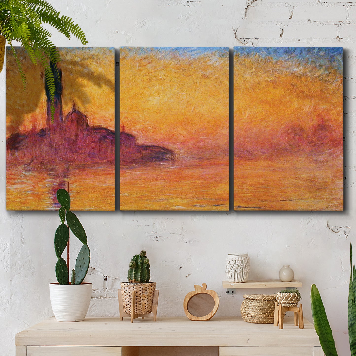 Three-panel canvas wall art featuring venetian church at twilight, displayed in a boho-chic entryway above a console table.
