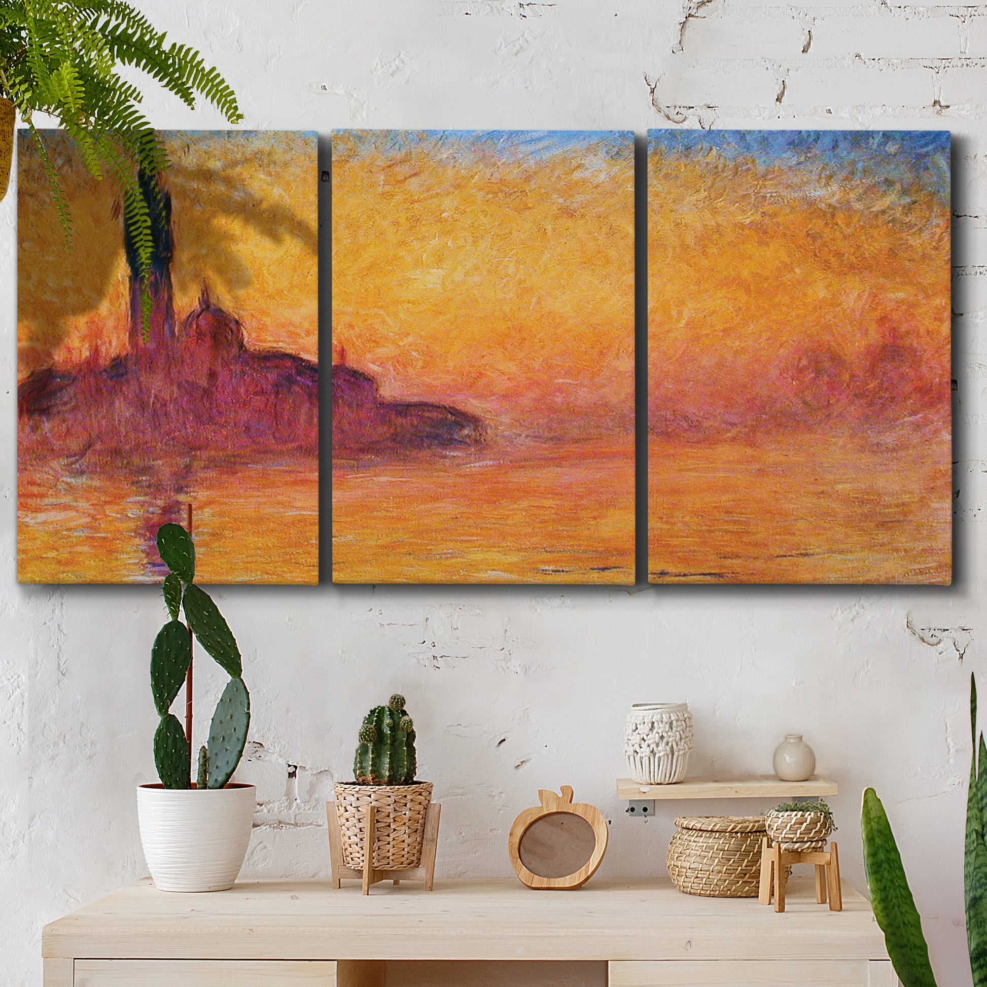 Three-panel canvas wall art featuring venetian church at twilight, displayed in a boho-chic entryway above a console table.