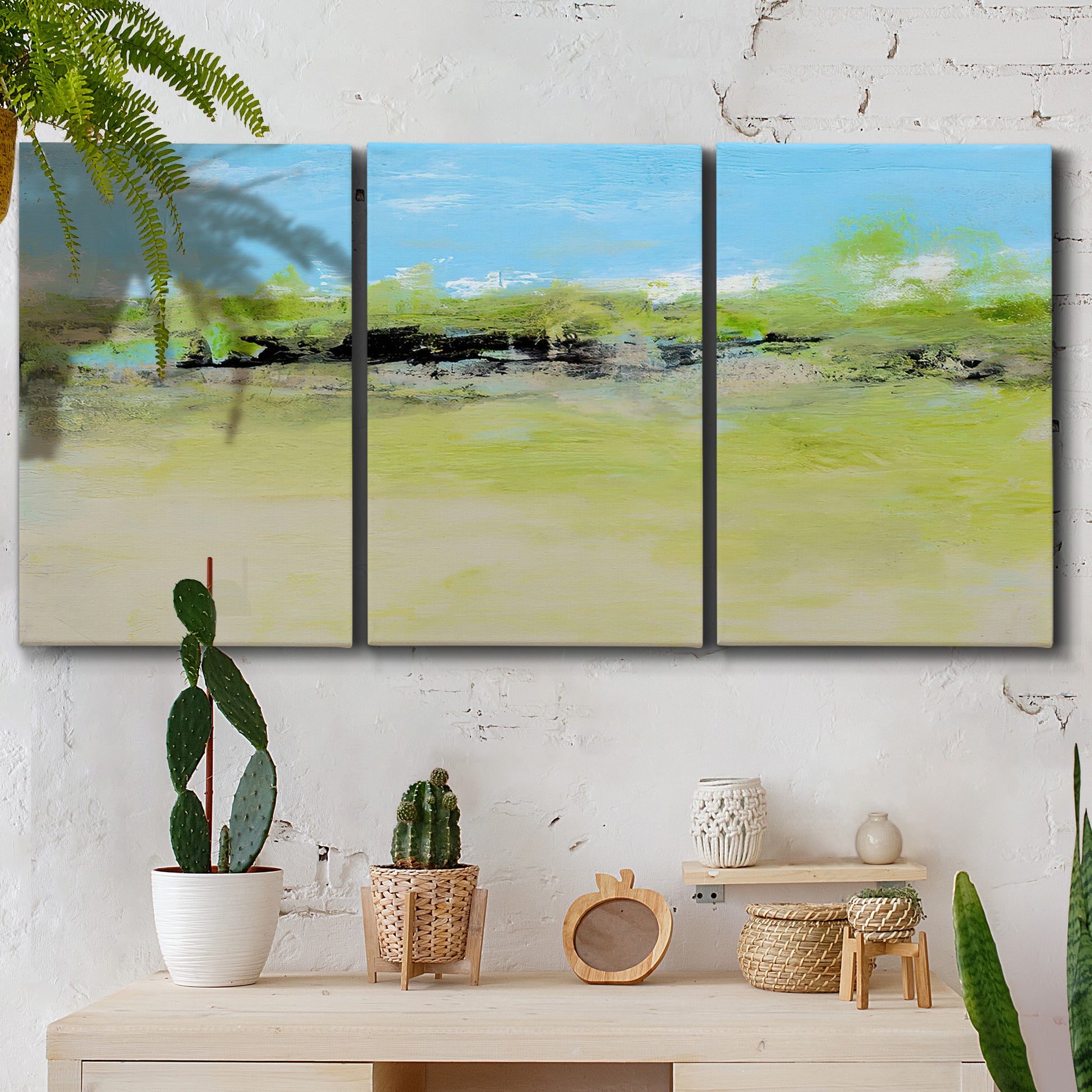 Three-panel canvas wall art featuring abstract terrace landscape view, displayed in a boho-chic entryway above a console table.