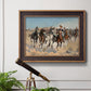 Impressionist western action scene by Frederic Remington in an ornate bronzed mahogany wood frame displayed in a light-toned interior setting.