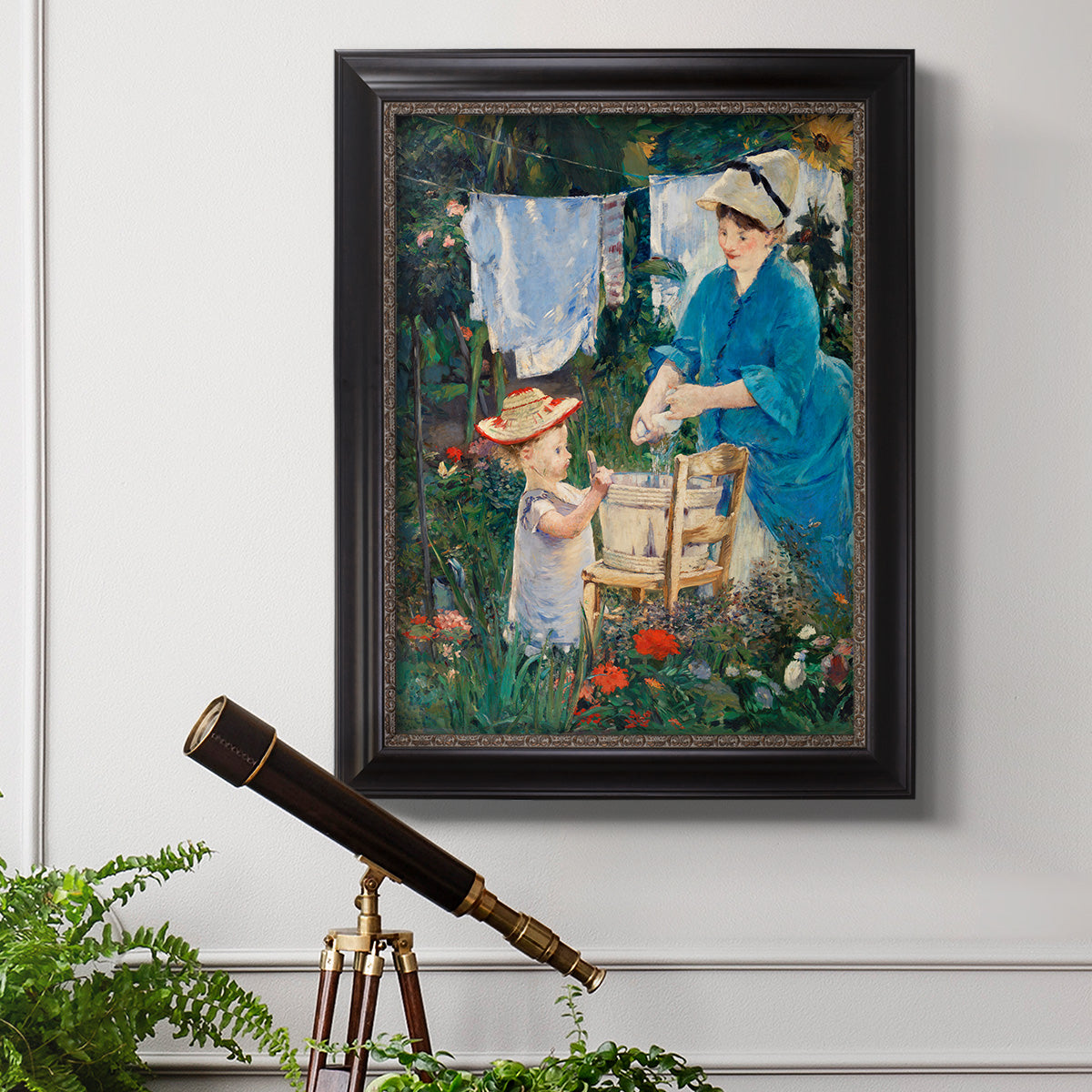 Intimate domestic genre scene by Édouard Manet in an ornate black frame with gilded inner detail displayed in a light-toned interior setting.