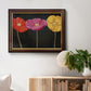 Contemporary poppy flower artwork in an ornate mahogany wood frame with gold liner displayed in a light-toned interior setting.