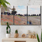 Three-panel canvas wall art featuring poppy field stretching across meadow, displayed in a boho-chic entryway above a console table.