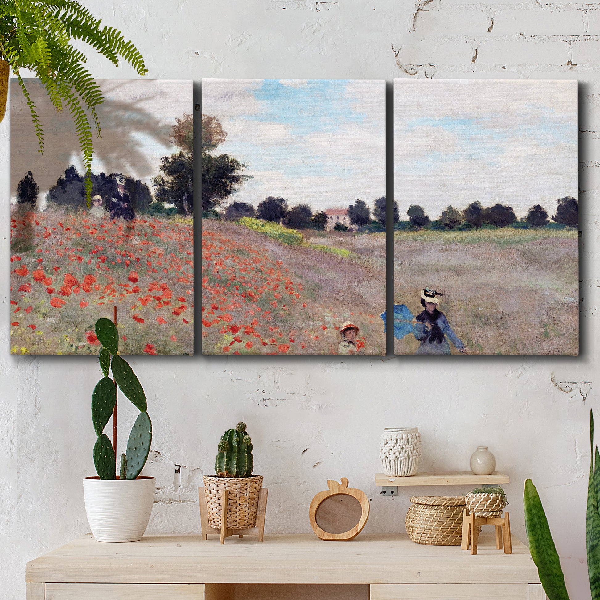 Three-panel canvas wall art featuring poppy field stretching across meadow, displayed in a boho-chic entryway above a console table.