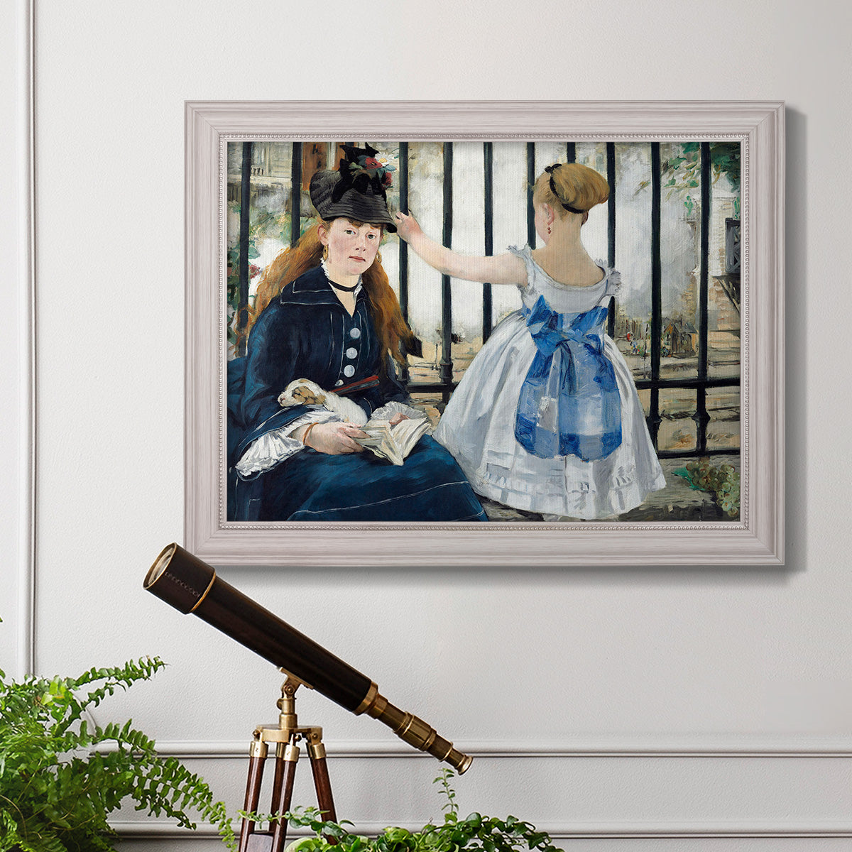 Impressionist urban scene near a railway by Édouard Manet in an ornate weathered white frame displayed in a light-toned interior setting.