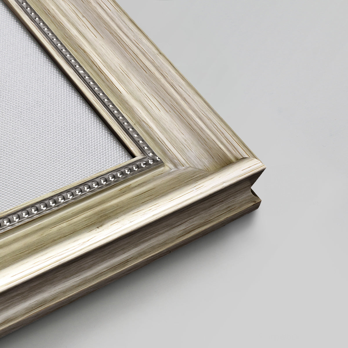 Detail of ornate champagne frame.