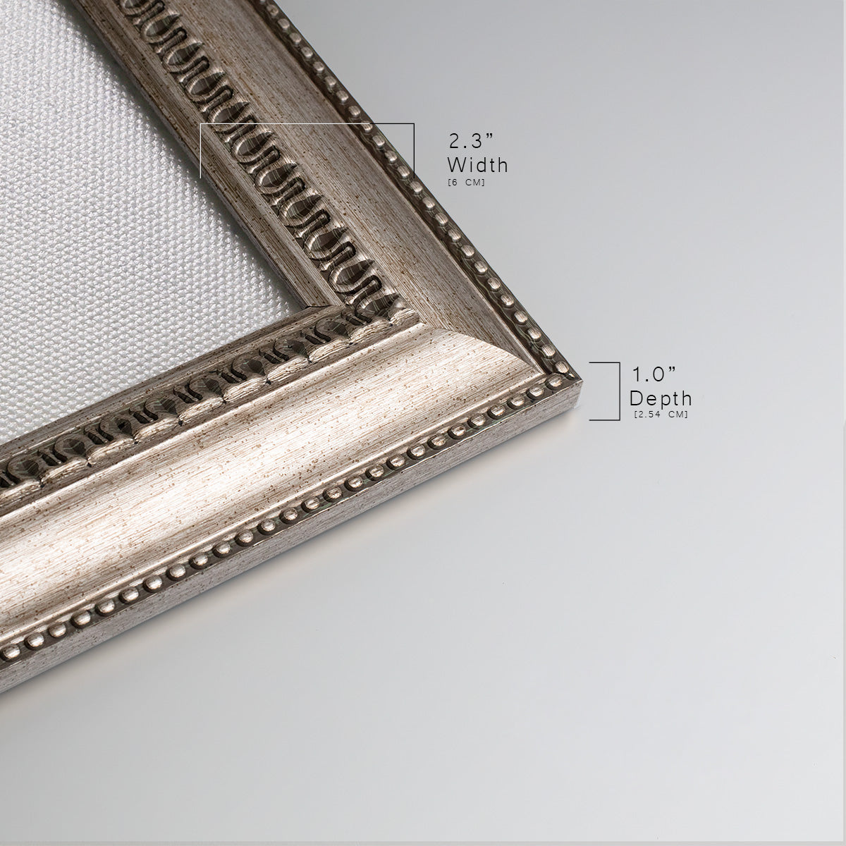 Detail of ornate vintage silver frame.