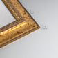 Detail of ornate vintage gold frame.