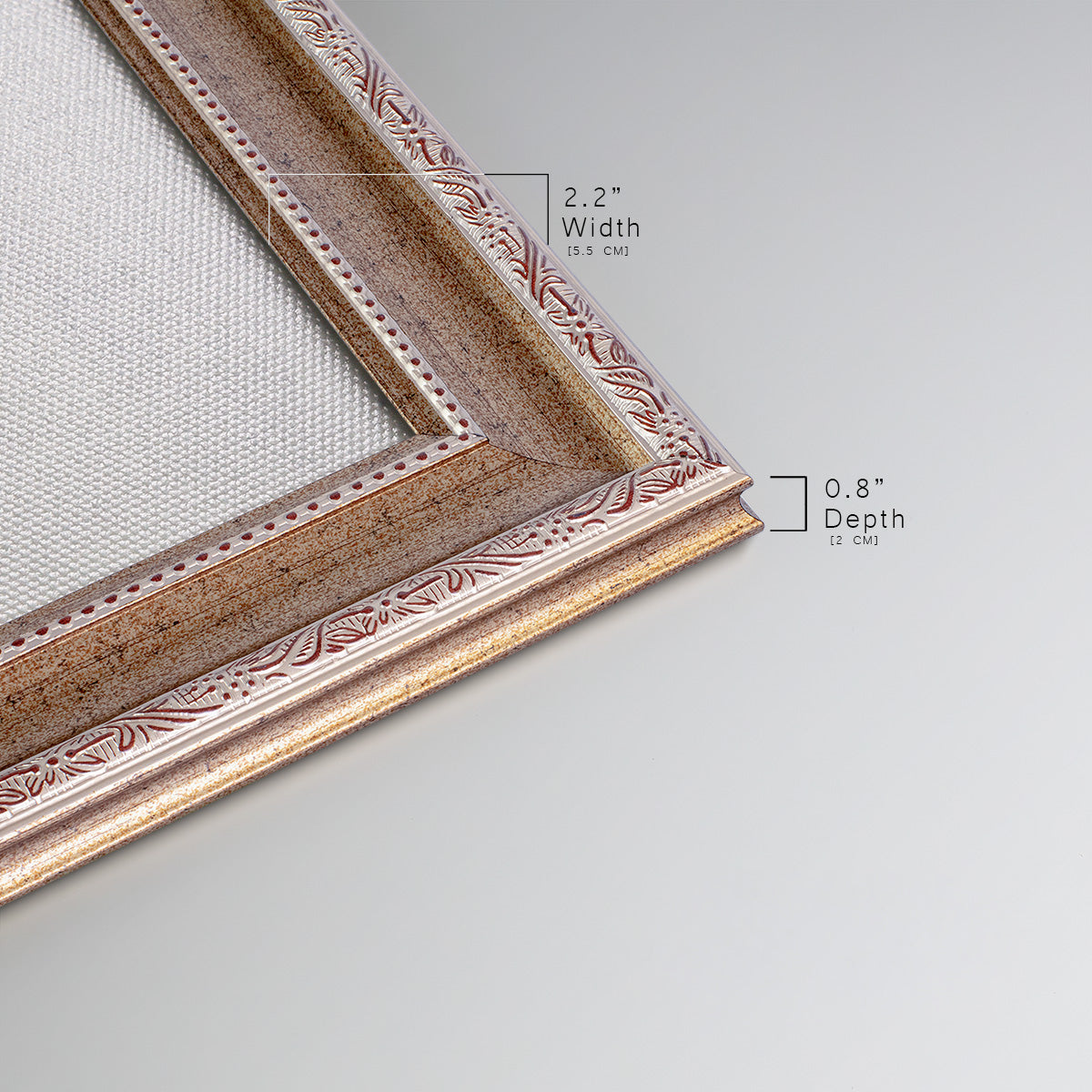 Detail of ornate traditional silver frame.